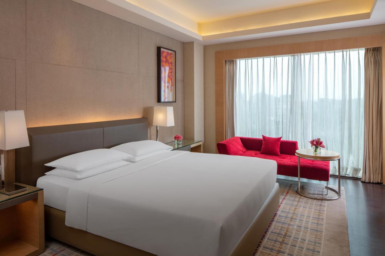 King Bed Pool View, Balcony with Bathtub & Club Access with Unlimited Complimentary IMFL beverages from 18:00 HRS to 20:00 HRS