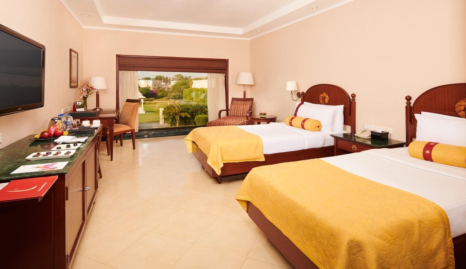 Lalit Garden view Twin Bed Complimentary Welcome Drink on arrival on session of couple's Spa on session of couple's Spa on Food & Beverage services on Laundry service upto 20 clothing item