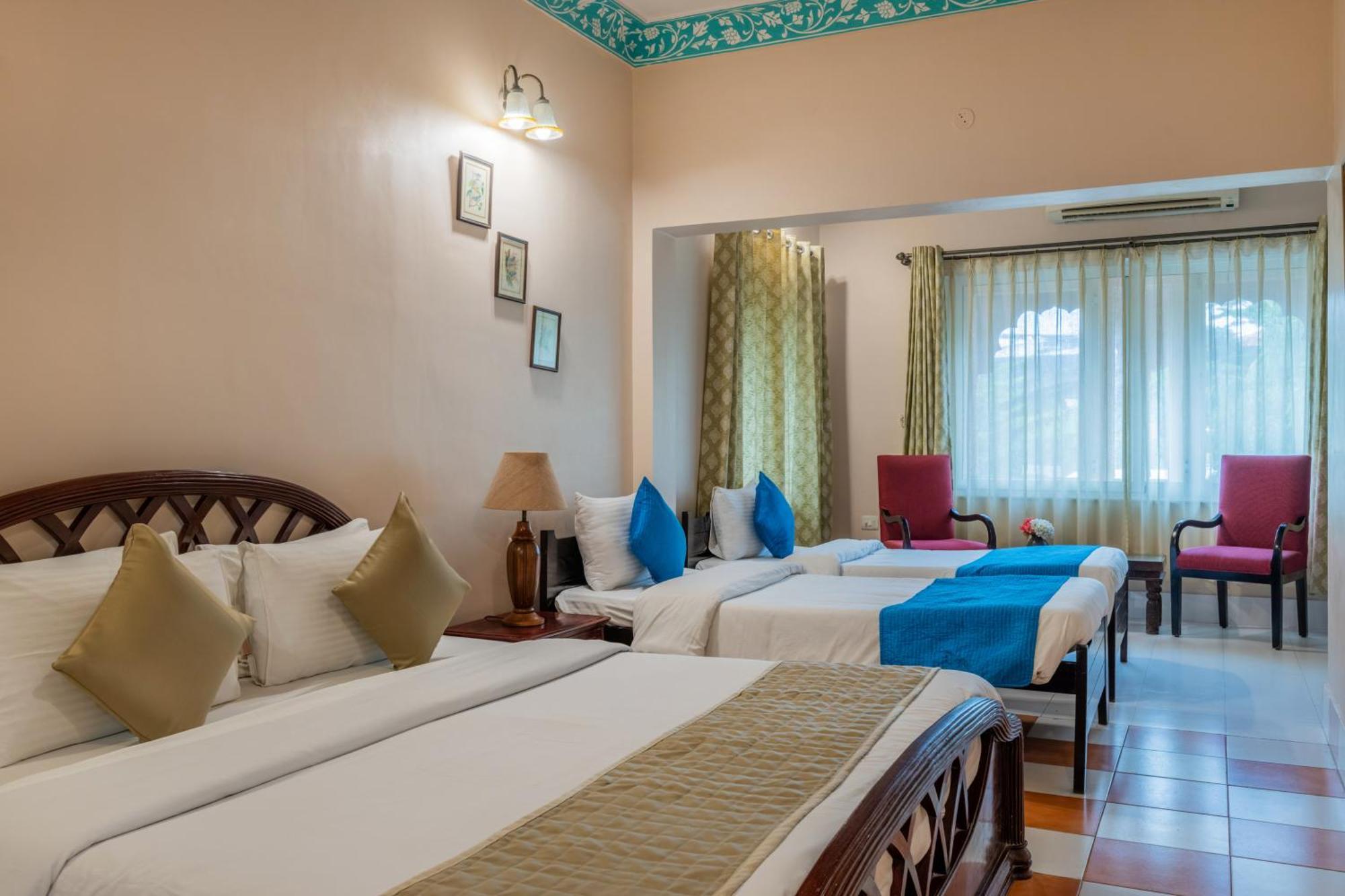 Classic Quadruple Room Includes pickup from airport or train station or bus station via tuk-tuk & a dedicated travel desk to assist local sightseeing tours intercity travel arrangements & activities,1697871502:JPEG